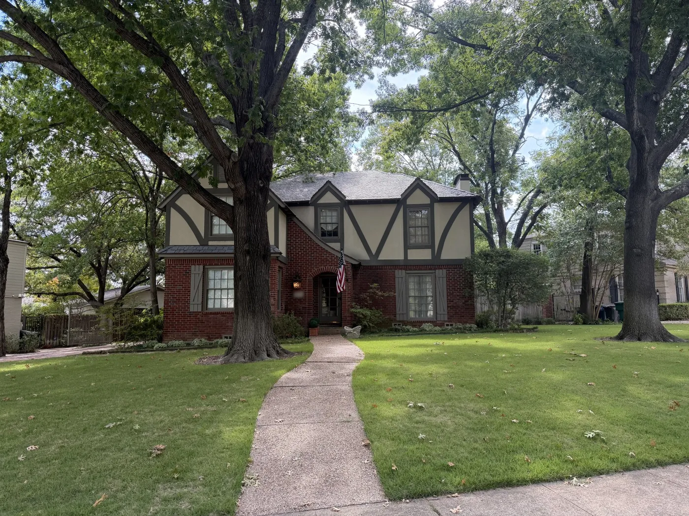 Brick and half-timbered Tudor-style home in Monticello, Fort Worth, with a completed attic insulation retrofit