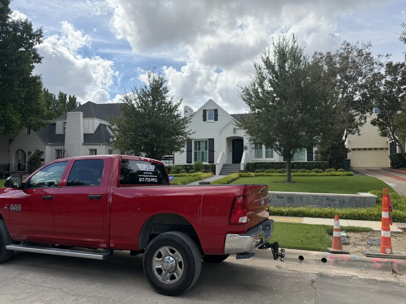 Top Gun Insulation truck parked at a completed attic insulation retrofit in Monticello, Fort Worth