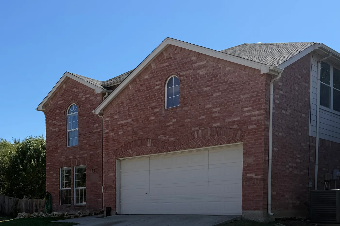 Two-story brick home in The Ranches, Fort Worth, where Top Gun Insulation completed an attic insulation retrofit